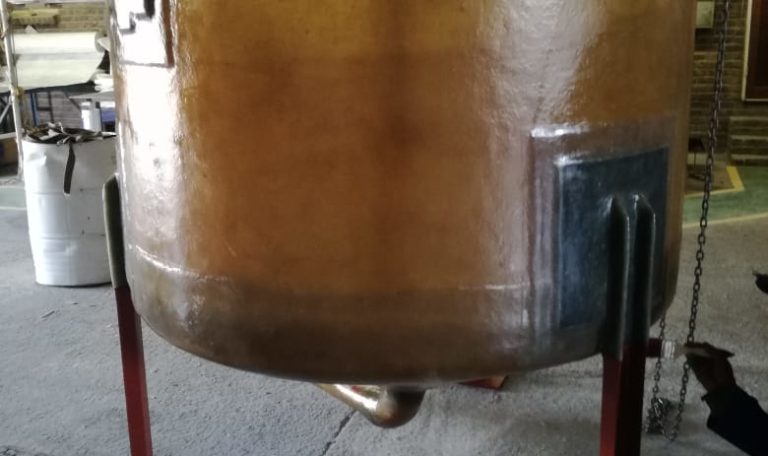 fibreglass chemical storage tank on steel legs