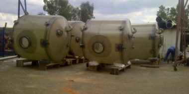 Four fibreglass storage tanks.
